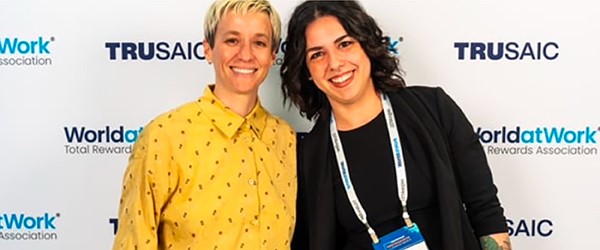 Employee Spotlight - Nadia Zahran) IGS Energy employee Nadia Zahran poses at a conference with soccer player Megan Rapinoe.