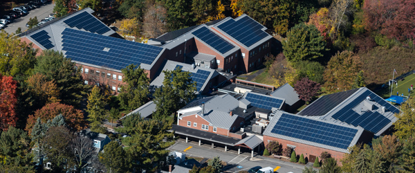 A nonprofit organization with financed solar panels on their roof)