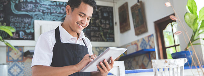 Small Business Owner using tablet)