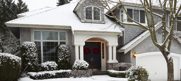 Home in the winter covered in snow)