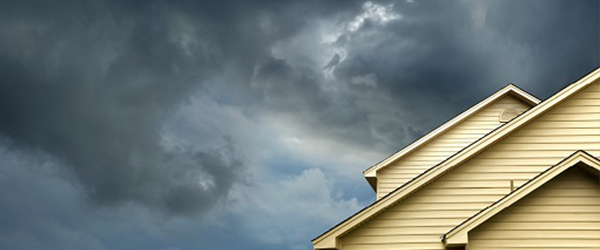 Cloudy skies over residential solar panels)